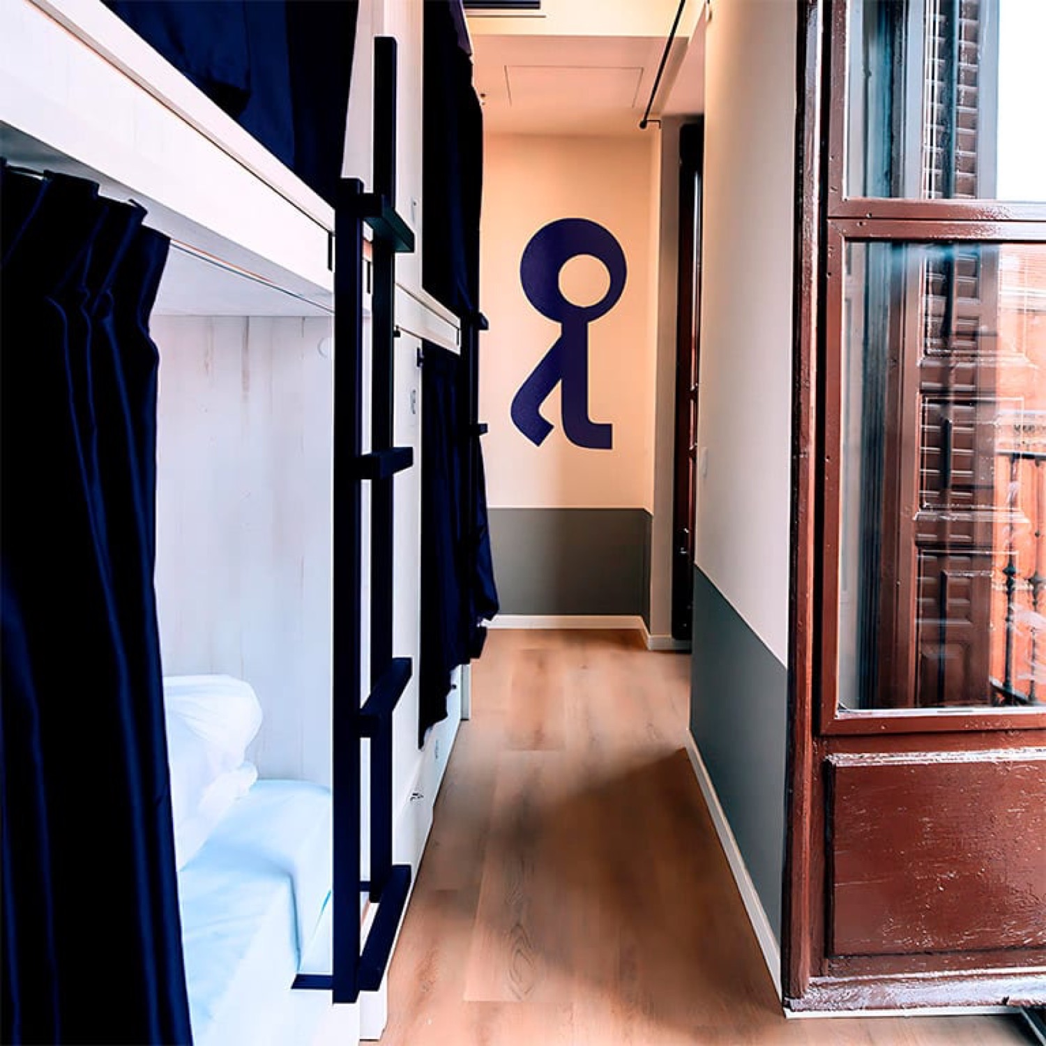 Twelve-bed shared room with bunks on both sides